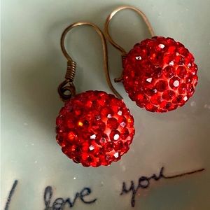 Sparkling studded red dangling round earrings